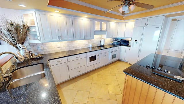 kitchen featuring white cabinets, white appliances, and sink