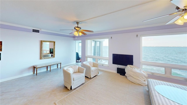 living room with crown molding and ceiling fan