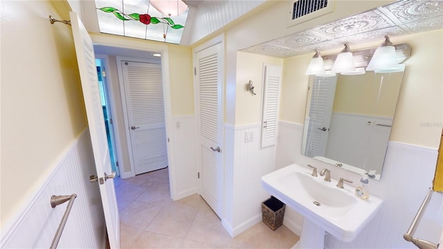 bathroom with tile patterned floors and sink