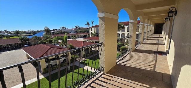 balcony featuring a water view