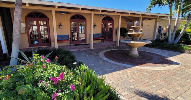 view of patio / terrace with ceiling fan and french doors