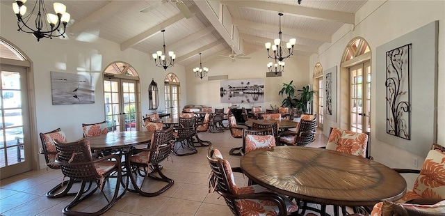 tiled dining area featuring beamed ceiling, french doors, high vaulted ceiling, and ceiling fan