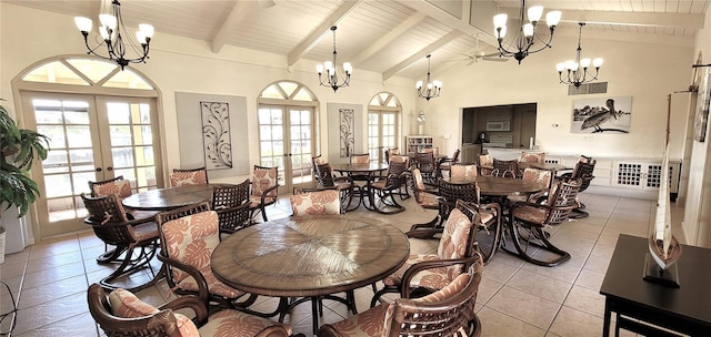 dining area with beamed ceiling, french doors, high vaulted ceiling, and light tile patterned flooring