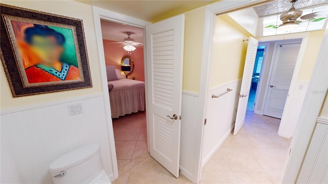 hallway with light tile patterned floors