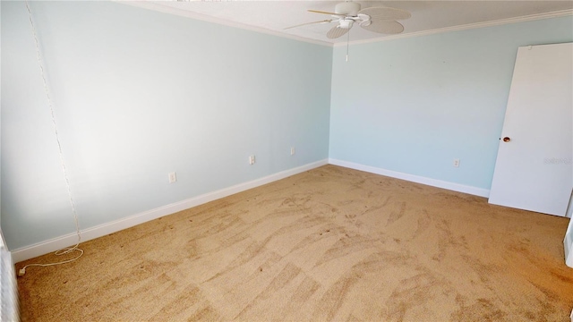 carpeted empty room featuring crown molding and ceiling fan