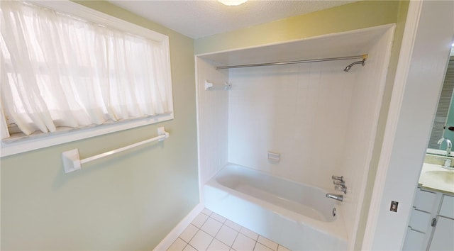 bathroom with vanity, tile patterned flooring, shower / tub combination, and a textured ceiling