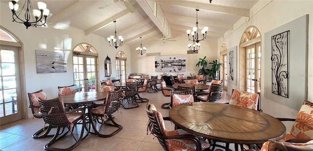 tiled dining room featuring beamed ceiling, high vaulted ceiling, french doors, and a chandelier