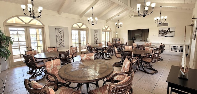 tiled dining room with an inviting chandelier and french doors