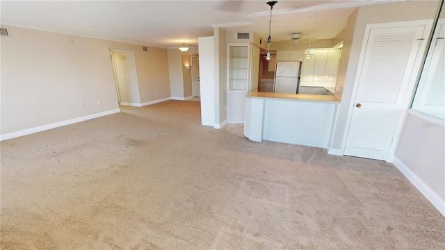 interior space with crown molding and light carpet