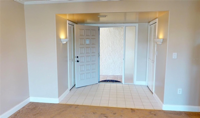 entrance foyer featuring light carpet