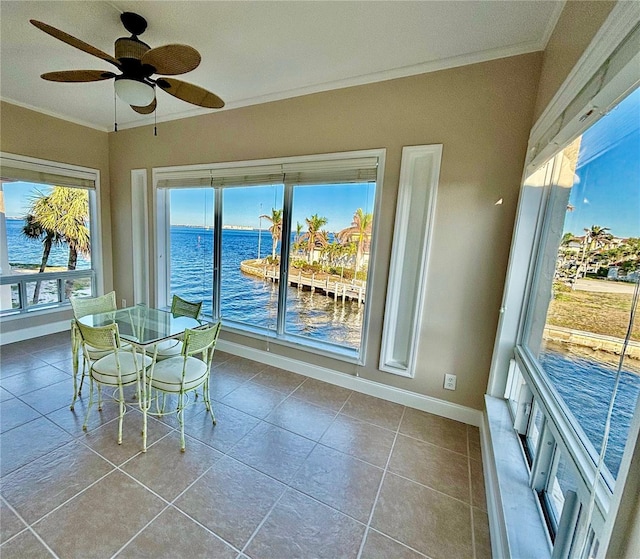 1 Colony Point Dr Unit 3C, Punta Gorda, FL 33950 - unfurnished dining area with a ceiling fan, baseboards, tile patterned flooring, a water view, and crown molding