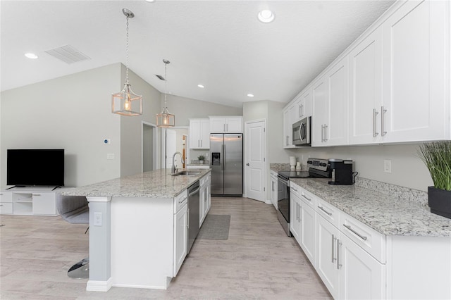 kitchen with white cabinets, appliances with stainless steel finishes, pendant lighting, and sink