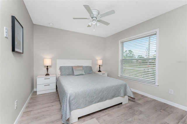 bedroom featuring ceiling fan and light hardwood / wood-style floors