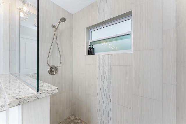 bathroom featuring tiled shower