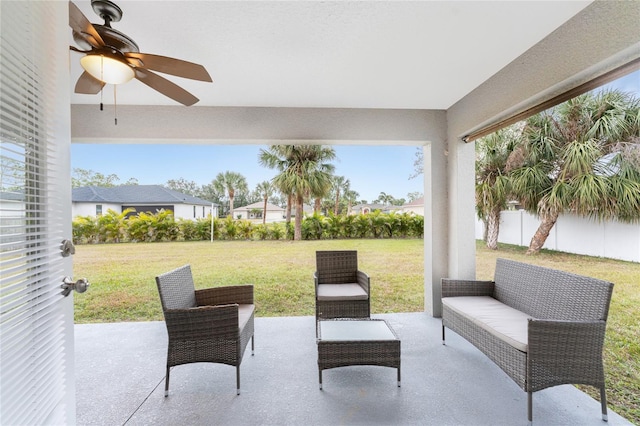 view of patio with an outdoor living space and ceiling fan