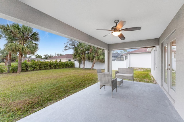 view of patio featuring french doors and ceiling fan