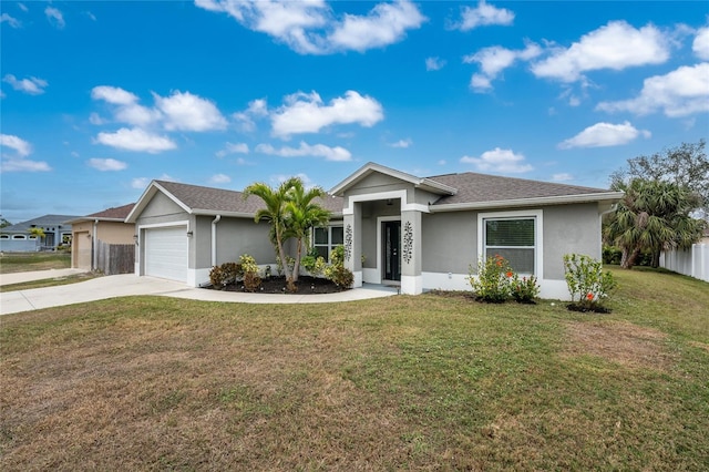 ranch-style home with a garage and a front yard