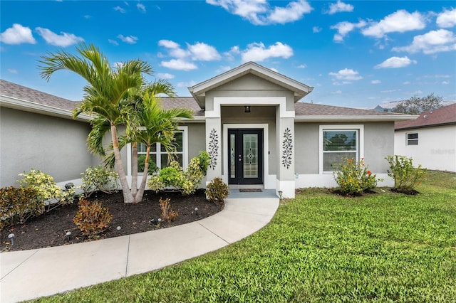 property entrance featuring a yard