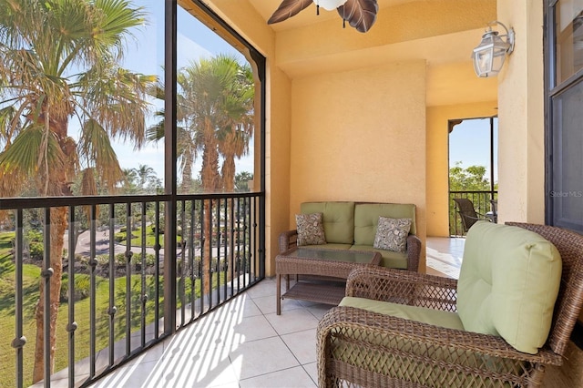 balcony with ceiling fan and an outdoor living space