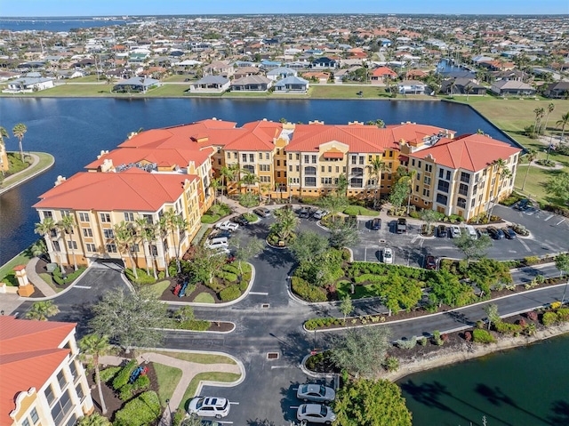 birds eye view of property with a water view