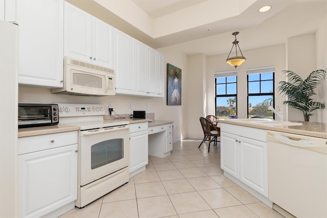 kitchen with sink, white cabinets, decorative light fixtures, white appliances, and light tile patterned floors