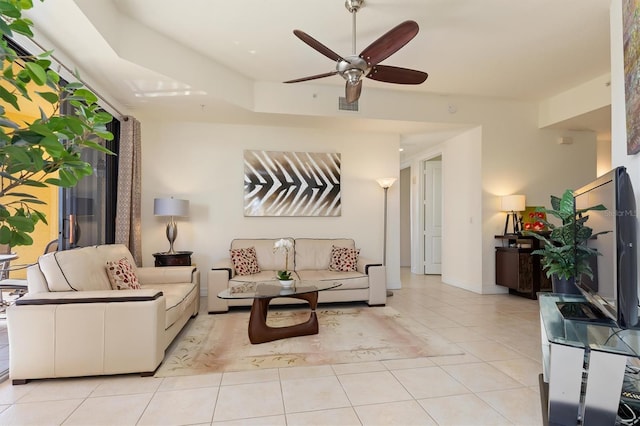 living room featuring ceiling fan and light tile patterned floors