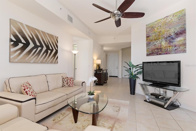 tiled living room with ceiling fan