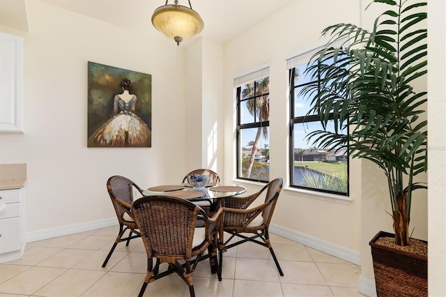 dining area with light tile patterned floors