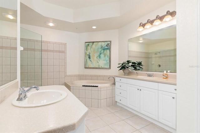 bathroom featuring vanity, separate shower and tub, and tile patterned floors