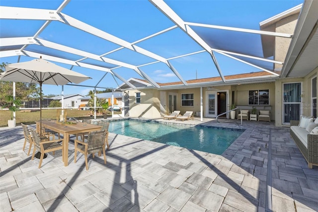 view of pool featuring a lanai and a patio