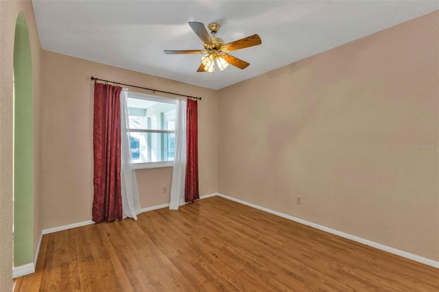 unfurnished room featuring ceiling fan and light hardwood / wood-style flooring