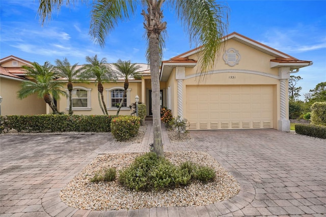 view of front of property featuring a garage