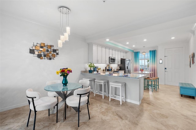 dining area with crown molding