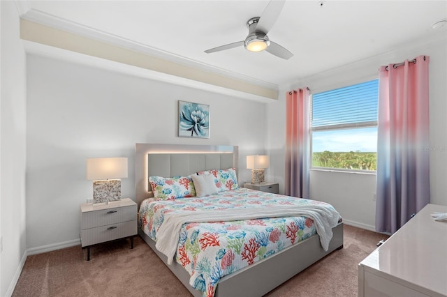 bedroom with ceiling fan, carpet floors, and ornamental molding