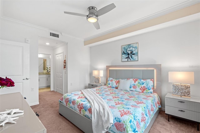 bedroom featuring ceiling fan, ornamental molding, connected bathroom, light colored carpet, and a closet