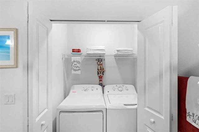 clothes washing area with washer and dryer