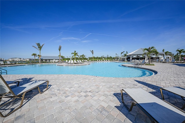 view of swimming pool with a patio area