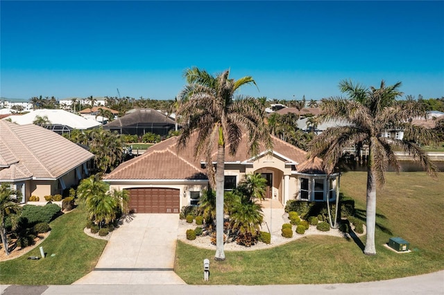 view of front facade with a front yard and a garage