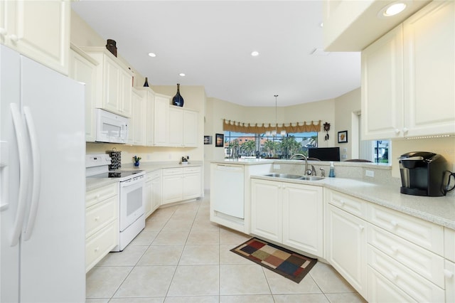 kitchen with sink, light tile patterned floors, pendant lighting, white appliances, and white cabinets