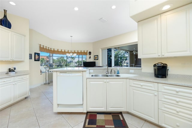 kitchen featuring white cabinetry, sink, a notable chandelier, white dishwasher, and pendant lighting