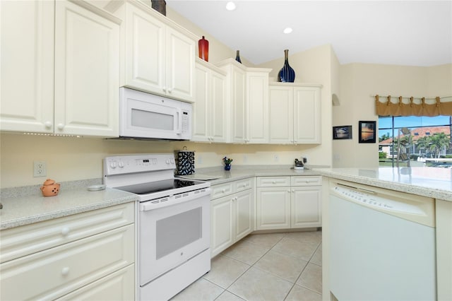 kitchen featuring white cabinetry, light tile patterned floors, light stone countertops, and white appliances