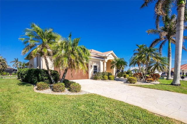 view of front of property with a garage and a front lawn