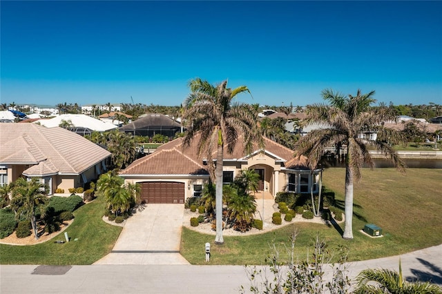 view of front of home with a front lawn and a garage