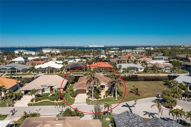 birds eye view of property with a water view