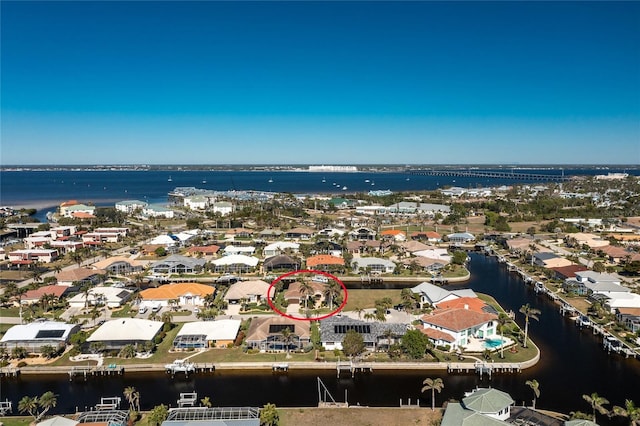 bird's eye view with a water view