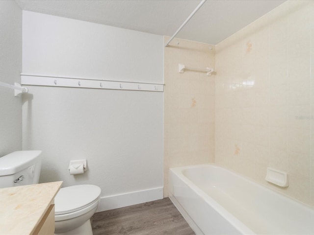 full bathroom with wood-type flooring, vanity, toilet, and tiled shower / bath