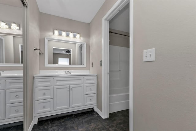 bathroom with ceiling fan and vanity