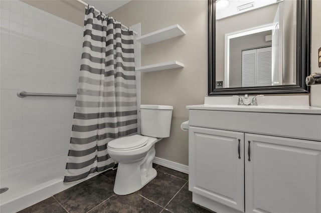 bathroom with curtained shower, tile patterned flooring, vanity, and toilet