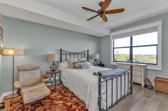 bedroom featuring ceiling fan and light hardwood / wood-style floors