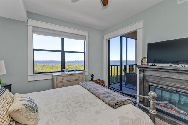 bedroom with ceiling fan and access to outside